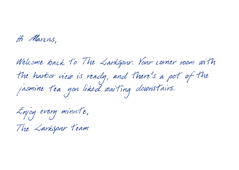 Handwritten 5 by 7 welcome card from a hotel, blue handwriting